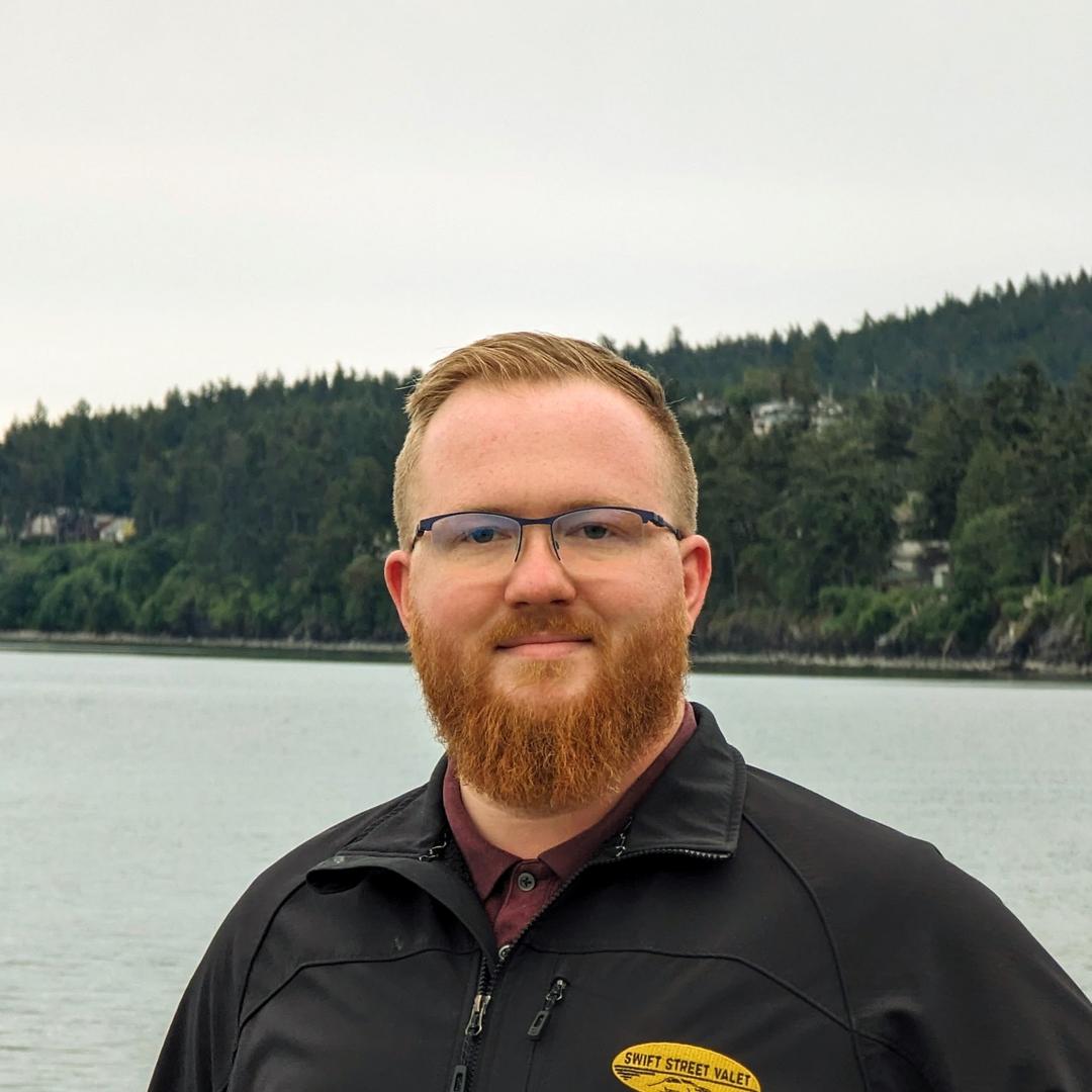 Headshot of Cameron Critchlow by the shoreline